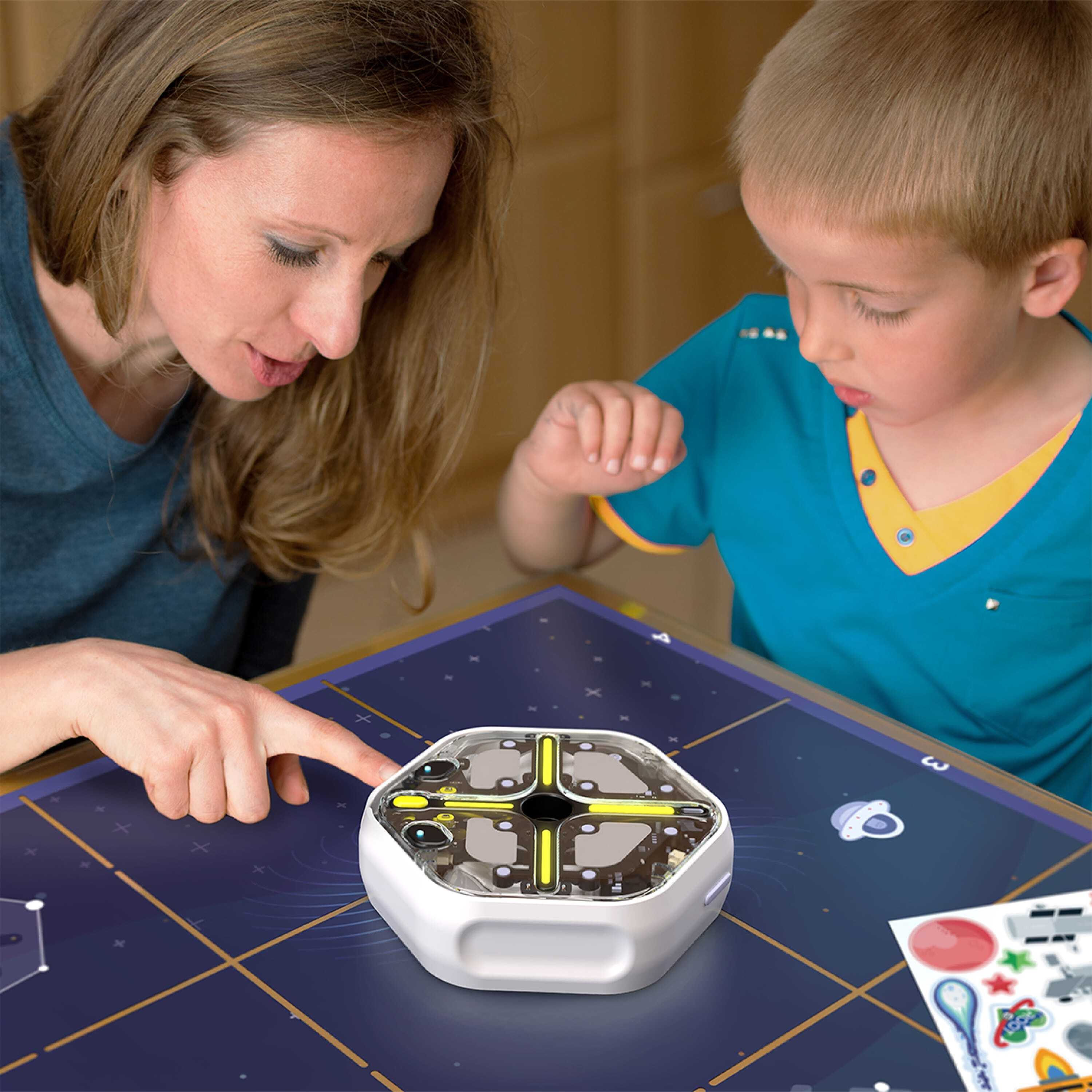 https://edu.irobot.com/assets/shop/Root-rt0_Coding-in-Outer-Space_Adventure-Pack-Accessory_Lifestyle-Home_Mom-Son_Vinyl-Clings_3000x3000_No-Logo.jpg